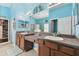 Double vanity bathroom with stylish light blue walls and large mirrors at 6843 Boulder Run Loop, Wesley Chapel, FL 33545