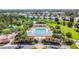 Community pool and recreational area with playground nearby at 6843 Boulder Run Loop, Wesley Chapel, FL 33545