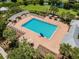 Community pool area with plenty of lounge chairs and umbrellas at 6843 Boulder Run Loop, Wesley Chapel, FL 33545