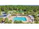 Community pool with a playground and other recreational amenities at 6843 Boulder Run Loop, Wesley Chapel, FL 33545