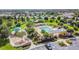 Community pool with pergola and surrounding landscaping at 6843 Boulder Run Loop, Wesley Chapel, FL 33545