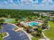 Resort-style community pool with lounge chairs and shaded areas at 6843 Boulder Run Loop, Wesley Chapel, FL 33545