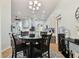 Dining room adjacent to kitchen, features round table and four chairs at 6843 Boulder Run Loop, Wesley Chapel, FL 33545