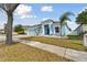 House exterior showcasing a light blue color scheme and landscaping at 6843 Boulder Run Loop, Wesley Chapel, FL 33545
