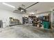 Spacious garage with ample storage shelving and workbench at 6843 Boulder Run Loop, Wesley Chapel, FL 33545