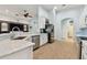 Modern kitchen with stainless steel appliances and white cabinets at 6843 Boulder Run Loop, Wesley Chapel, FL 33545