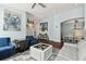 Spacious living area with hardwood floors, light walls, and ocean decor at 6843 Boulder Run Loop, Wesley Chapel, FL 33545