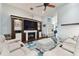 Living room features a built-in entertainment center and fireplace at 6843 Boulder Run Loop, Wesley Chapel, FL 33545