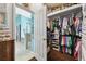 Well-organized walk-in closet with custom shelving and hanging rods at 6843 Boulder Run Loop, Wesley Chapel, FL 33545