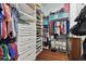 Large walk-in closet with ample shelving and drawers at 6843 Boulder Run Loop, Wesley Chapel, FL 33545