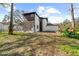 House exterior showcasing a large backyard with mature trees at 8119 N Dakota, Tampa, FL 33604