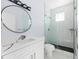 Updated bathroom featuring a walk-in shower and white vanity at 8119 N Dakota, Tampa, FL 33604