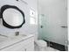 Modern bathroom with white cabinets, marble countertops, and a glass shower at 8119 N Dakota, Tampa, FL 33604