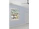 Empty bedroom with light gray walls, white trim, and vinyl plank flooring at 8119 N Dakota, Tampa, FL 33604
