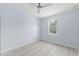 Light gray bedroom with ceiling fan and vinyl plank flooring at 8119 N Dakota, Tampa, FL 33604