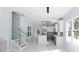 Modern kitchen with white cabinets, marble island and stainless steel appliances at 8119 N Dakota, Tampa, FL 33604