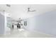 Open living area with white marble floor and ceiling fan at 8119 N Dakota, Tampa, FL 33604