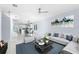 Living room with light gray walls, white marble floors, and sofas at 8119 N Dakota, Tampa, FL 33604