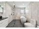 Elegant bathroom featuring a freestanding tub and glass shower enclosure at 221 Howard Dr, Belleair Beach, FL 33786