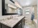 Modern bathroom with double vanity and marble countertop at 221 Howard Dr, Belleair Beach, FL 33786