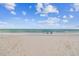 Relaxing beach scene with calm ocean and two chairs at 221 Howard Dr, Belleair Beach, FL 33786