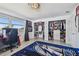 Bedroom with a bed, gaming setup, and large closet at 221 Howard Dr, Belleair Beach, FL 33786