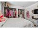 Bedroom with bed, closet, and tv at 221 Howard Dr, Belleair Beach, FL 33786