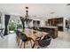 Modern kitchen with dark cabinetry, quartz countertops and breakfast bar at 221 Howard Dr, Belleair Beach, FL 33786