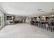 Open concept kitchen boasts expansive island and breakfast bar at 221 Howard Dr, Belleair Beach, FL 33786