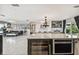 Modern kitchen with large island, stainless steel appliances, and granite countertops at 221 Howard Dr, Belleair Beach, FL 33786