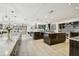 Modern kitchen with large island and marble countertops at 221 Howard Dr, Belleair Beach, FL 33786
