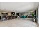 Open concept kitchen features island with seating and high-end appliances at 221 Howard Dr, Belleair Beach, FL 33786