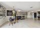 Living room with gallery wall, comfortable seating and statement chandelier at 221 Howard Dr, Belleair Beach, FL 33786