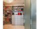 Large walk-in closet with ample shelving and drawer space at 221 Howard Dr, Belleair Beach, FL 33786