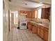 Basic kitchen with light wood cabinets at 304 E Hanlon St, Tampa, FL 33604