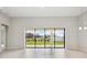 Dining room with sliding glass doors leading to a view of the backyard at 13142 Homestead Ln, Parrish, FL 34219