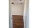 Bedroom featuring wood floors, a ceiling fan, and neutral colored walls at 277 Valencia Cir, St Petersburg, FL 33716
