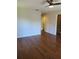 Bedroom featuring wood floors, a ceiling fan, and neutral colored walls at 277 Valencia Cir, St Petersburg, FL 33716