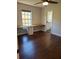 Bedroom featuring wood floors, a window with a built-in desk, and a door to the bathroom at 277 Valencia Cir, St Petersburg, FL 33716