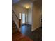 The entryway features tile floors, neutral paint, and a staircase on the left at 277 Valencia Cir, St Petersburg, FL 33716