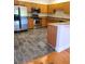 Kitchen featuring stainless steel appliances, granite countertops, and hexagon tile floors at 277 Valencia Cir, St Petersburg, FL 33716