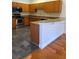 Kitchen with stainless steel appliances, wood cabinets, and granite countertops at 277 Valencia Cir, St Petersburg, FL 33716