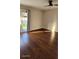 Bright living room featuring hardwood floors and sliding glass doors at 277 Valencia Cir, St Petersburg, FL 33716