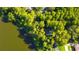 Aerial view showcasing home's waterfront lot and private dock at 17210 Orangewood Dr, Lutz, FL 33548