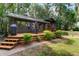Spacious deck with seating area and grill, surrounded by lush greenery at 17210 Orangewood Dr, Lutz, FL 33548