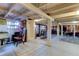 Spacious basement with high ceilings, workshop area, and storage at 17210 Orangewood Dr, Lutz, FL 33548