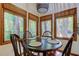 Small dining area with round table and four chairs at 17210 Orangewood Dr, Lutz, FL 33548