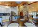 Kitchen dining area with a round table and stone feature wall at 17210 Orangewood Dr, Lutz, FL 33548