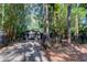Home's gated entrance with a brick driveway, leading to garage at 17210 Orangewood Dr, Lutz, FL 33548