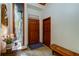 Bright and welcoming entryway with rustic wooden bench and large window at 17210 Orangewood Dr, Lutz, FL 33548